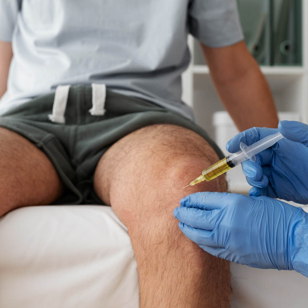 Man receiving injection as part of stem cell therapy in Bogotá